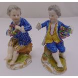 Two 19th Meissen century figurines of seated boys with flowers, marks to the base, 12.5cm (h)