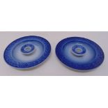 A pair of Royal Copenhagen taperstick holders of circular form with stylised borders, marks to the