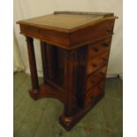 A Victorian mahogany Davenport of customary form with tooled leather hinged top, five drawers on