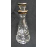 A clear glass conical shaped decanter with plain silver mounts and drop stopper, import marks