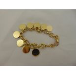 9ct yellow gold charm bracelet with ten charms, approx total weight 37.0g
