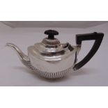 An oval hallmarked silver teapot, part fluted with angled handle, A/F, Birmingham 1901, approx total