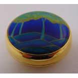 Moorcroft enamel and gilded metal paperweight, signed to the base, 6cm diameter