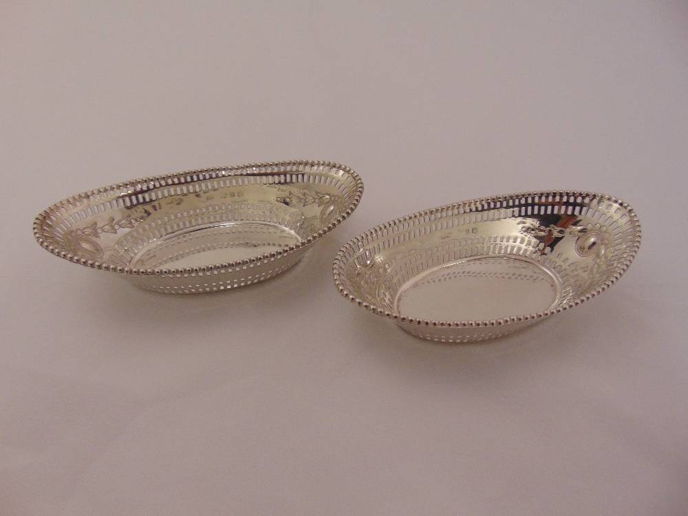 A pair of silver oval bonbon dishes, bar pierced sides beaded borders, Birmingham 1969, approx total