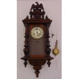 A late 19th century Viennese wall regulator, mahogany case with white enamel dial to include key and