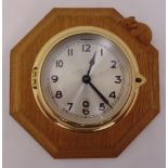A Robert Mouseman Thompson octagonal oak wall clock, silvered dial with Arabic numerals, 24cm