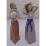 Two Lladro figurines of girls with hats, marks to the bases, 25cm (h)