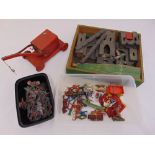 A quantity of play worn toys to include diecast cowboys and Indians, a Triang Fort and a red crane