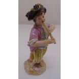 Meissen figurine of a boy playing a flute with grapes in a wooden jug, marks to the base, 12.5cm (
