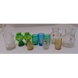 A quantity of Mary Gregory painted glassware to include jugs and beakers (11)