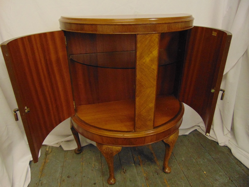 A mahogany and satinwood demi-lune cabinet with hinged doors on four scroll legs, 99 x 78 x 38.5cm - Image 2 of 2