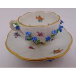 Meissen Deutche Blumen cup and saucer with applied flowers to cup and saucer, marks to the base