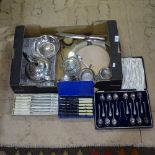 A collection of silver plated teaware, cased cutlery, a bread board etc