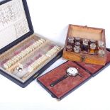 A French dental student's box with original bottles, length 17cm, a box of microscope slides, and