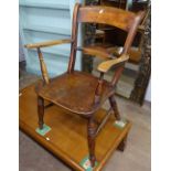 A Victorian elm-seated kitchen Windsor elbow chair