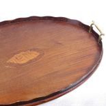 An Edwardian inlaid tea tray with brass handles and inlaid shell motif, length 59cm