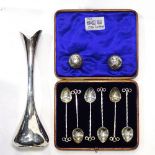 A set of 6 Arts and Crafts silver teaspoons with stylised ends, London 1912, a pair of miniature