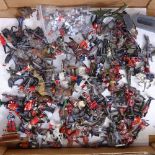 A box of diecast miniature regimental figures and accessories