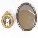 An enamelled oval photo frame, and a small gilt bow-top photo frame, height 8cm