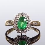 A 9ct gold emerald and diamond cluster ring, diamond set shoulders, maker's marks DS & Co, hallmarks