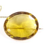 An unmarked gold oval-cut citrine brooch, brooch length 32.4mm, 11.4g