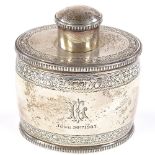 A late Victorian oval barrel-shaped silver tea caddy, with engraved floral and acorn decoration with