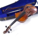 An early 20th century violin, back length 35.5cm, with 2 bows and case