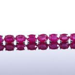 A sterling silver ruby line bracelet, total oval-cut ruby content approx 35ct, bracelet length 18.