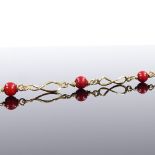 An 18ct gold red bead bracelet, bracelet length 17.5cm, 4.6g