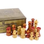 A carved and stained nut or vegetable ivory chess set, late 19th/early 20th century, King height 8.