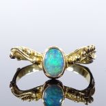 An unmarked gold opal wishbone ring, relief berry shoulders, setting height 8.2mm, size T, 3.5g