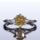 A platinum 1.12ct natural fancy deep brownish yellow solitaire diamond ring, cushion modified