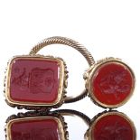 2 19th century unmarked yellow metal carnelian intaglio seal fobs, both depicting rampant lion