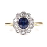 An 18ct gold sapphire and diamond cluster flowerhead ring, setting height 10.8mm, size N, 2.7g