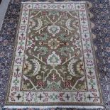An Afghan cream ground Ziegler wool rug, floral decoration, 202cm x 138cm