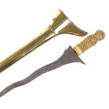 An Indonesian Kriss dagger, with ornately relief carved ivory hilt and gilt-brass scabbard,