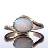 A 9ct gold opal dress ring, crossover style settings, setting height 9.5mm, size Q, 3g