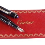 A Cartier black/steel-cased fountain pen, spare ink filler, original case and box, perfect condition