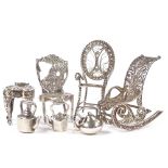 A group of Continental silver dolls house furniture, including filigree rocking chair, Dutch side