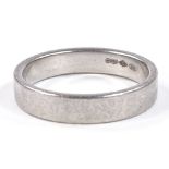 A platinum wedding band ring, maker's marks DOM, band width 4.1mm, size Q, 7.5g
