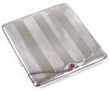 CARTIER - an Art Deco French silver matchbox case, with cabochon ruby thumbpiece, engine turned