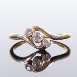 An 18ct gold 3-stone diamond crossover ring, total diamond content approx 0.12ct, setting height 7.