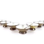 A set of 7 Volmer Bahner Danish vermeil silver and white enamel salt bowls, and a matching spoon,