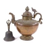 An ornate Tibetan brass and copper kettle with dragon handle, height 28cm, and a Tibetan hand