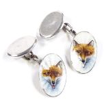 A pair of Continental silver and enamel hunting fox head oval cufflinks, panel length 18.8mm, 6.5g