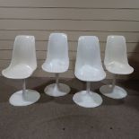 A set of 4 tulip dining chairs in the style of Eero Saarinen
