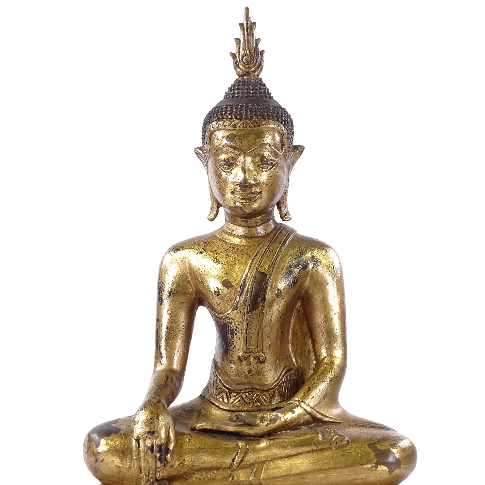 An Oriental gilt-bronze heavy gauge seated Buddha, height 56cm