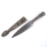 A white metal-cased Gaucho knife, with original scabbard and embossed floral decoration, overall