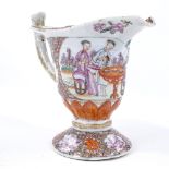 An 18th century Chinese porcelain sauce boat with polychrome hand painted decoration, depicting