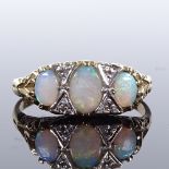 A 9ct gold 7-stone opal and diamond half-hoop ring, scroll engraved bridge and shoulders, setting
